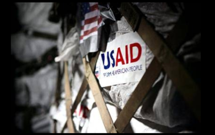 USAID poster. Photo courtesy US Army Africa via Flickr Creative Commons.