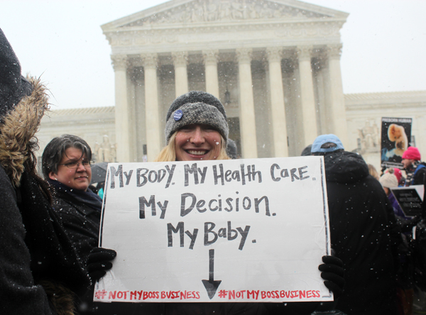 Deodonne Bhattarai of Washington, D.C., who is 7 1/2 months pregnant, demonstrated in front of the Supreme Court, which heard cases of two businesses challenging the contraception mandate of the Affordable Care Act on March 25, 2014. RNS photo by Adelle M. Banks