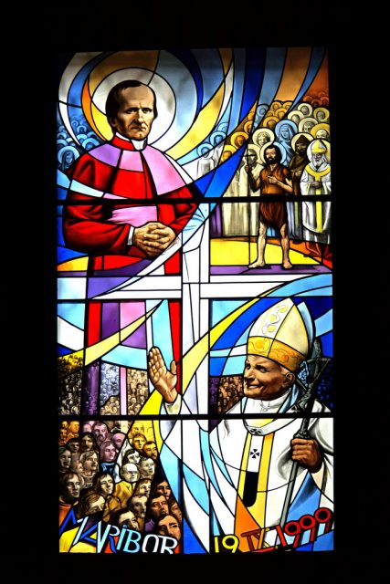 Stained glass window of Pope John Paul II.