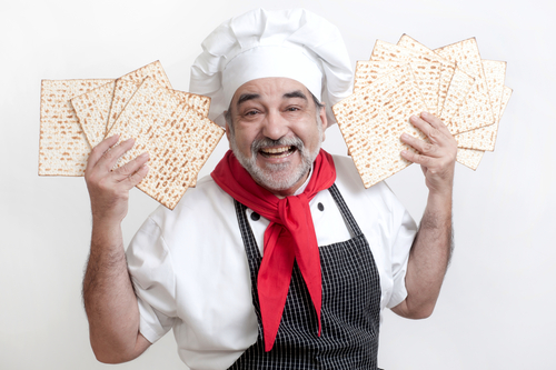A smiling chef with matzo.