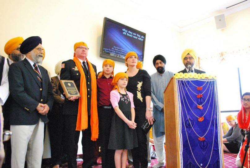 Brian Murphy, second from left, with his family, was honored at the Guru Gobind Singh Foundation, a Sikh spiritual center in Rockville, Md. Photo courtesy of Rajinder Babra