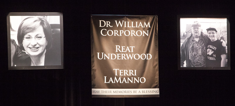 Banners honor Dr. William Corporon, Reat Underwood and Terri LaManno during an interfaith 
