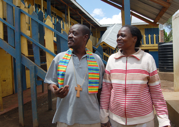 Rev. John Makokha, the founder and Senior Pastor at the Riruta Hope Community Church, and his wife Anne Baraza inside the compound of the Church. Religion News Service photo by Fredrick Nzwili 