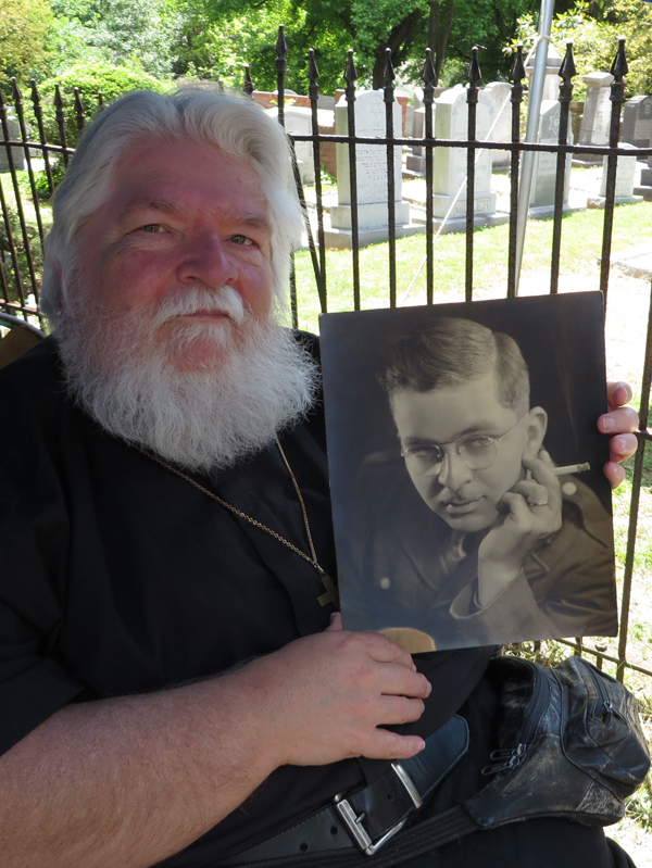 (RNS) Joseph Corsbie holds up a photo of his father, David Walter Corsbie Jr., who came into possession of ashes from the Dachau concentration camp during his military service. RNS photo by Yonat Shimron.