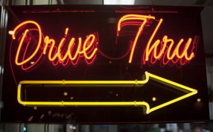 A neon drive through-sign