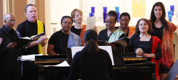 A choir led songs during a Mass held by members of the U.S. Conference of Catholic Bishops’ Committee on Migration at a Capitol Hill church on Thursday (May 29). The service included multiple languages, such as Swahili, Arabic, Spanish, German and English. Religion News Service photo by Heather Adams