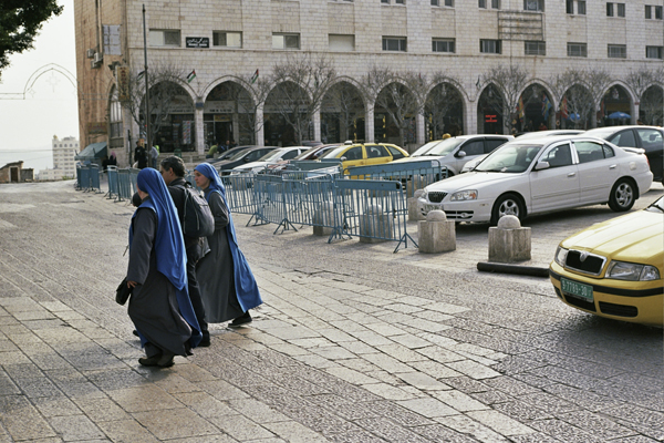 Two nuns cross the street in front of the Church of the Nativity in Bethlehem, where Pope Francis will make his first visit on Sunday, May 25. Photo courtesy of Evan Simko-Bednarski