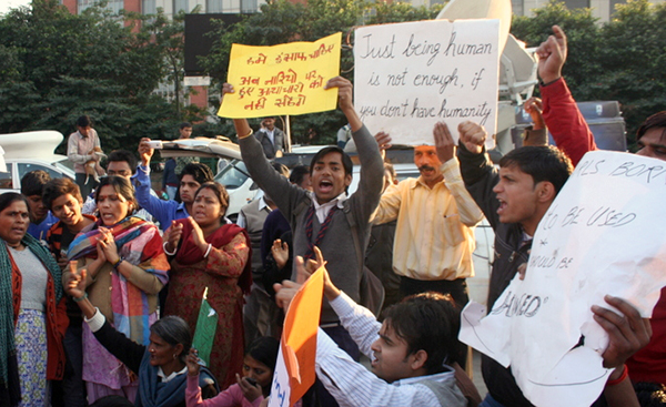 Protestors rally outside Sufdarjung Hospital in 2012 while seeking justice for a gang rape victim. Despite recent reform to toughen India's sexual violence laws, India's male-dominated and socially stratified culture isn't helping solve the problem, critics say.