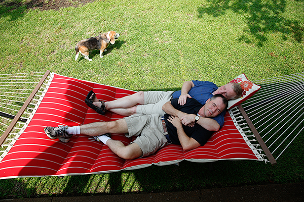 Mark Phariss and Vic Holmes (wearing dark blue shirt), of Plano, Texas, relax on a hammock while they enjoy a Saturday at their lake house in Gun Barrel City, Texas on May 31, 2014.  Phariss and Holmes are the plaintiffs in the main Texas lawsuit seeking same-sex marriage rights. Photo by Mei-Chun Jau, courtesy of USA Today