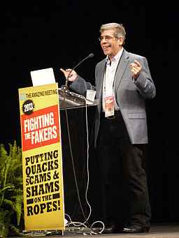 Jerry Coyne speaking at The Amazing Meeting in 2013. Photo by user zooterkin, via Wikimedia Commons.