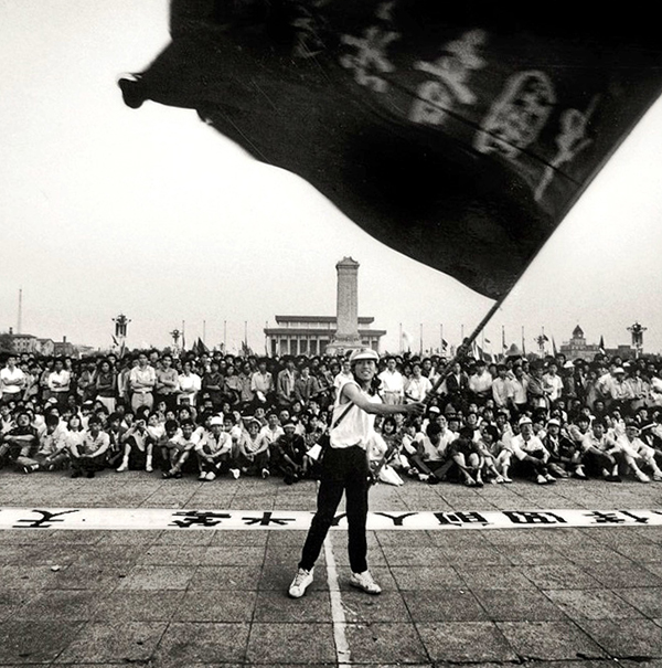 A man waves a flag in May, 1989, at China's Tiananmen Square.