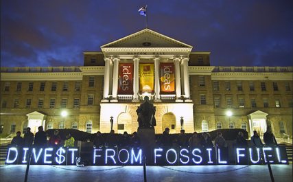 Activists support fossil fuel divestment in front of the University of Wisconsin-Madison's Bascom Hall on April 5, 2014. Fossil fuel divestment has gained support from a growing number of religious organizations, including Union Theological Seminary, World Council of Churches, the Unitarian Universalists and the United Church of Christ.