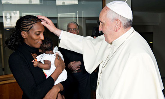 Meriam Ibrahim, the Sudanese woman who was nearly executed for apostasy for marrying a Christian man, and her daughter, Maya, meet Pope Francis at the Vatican after arriving in Italy on July 24, 2014, en route to the United States. Photo courtesy L'Osservatore Romano