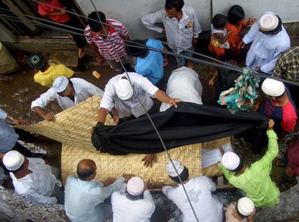 Muslims prepare a body for burial in Dhaka, Bangladesh.