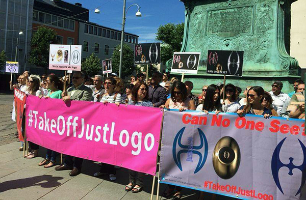 Activists in Gothenburg, Sweden, protest the symbol featured in Roberto Cavalli's 