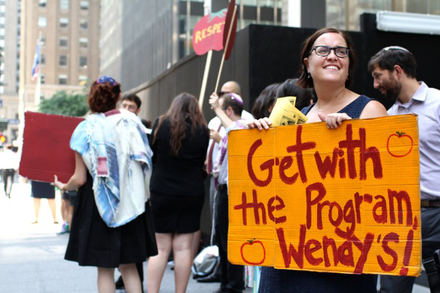 Salem Pearce and other rabbis and rabbinical students from T'ruah protest outside the Trian Partners offices in New York City on July 8, 2014.