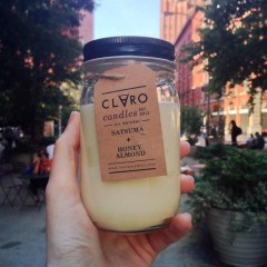 Claro's "Freedom" candle is scented with Satsuma and Honey Almond. 