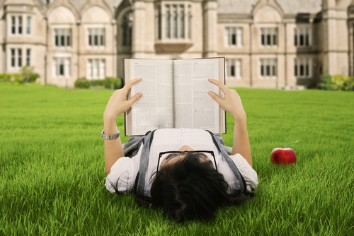 A female college student reading a book.