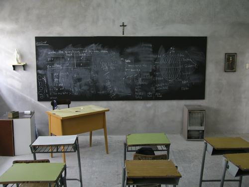 An empty Catholic school classroom.