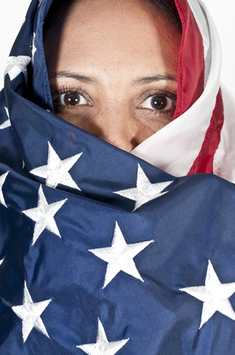 Woman with an American flag wrapped around her head.