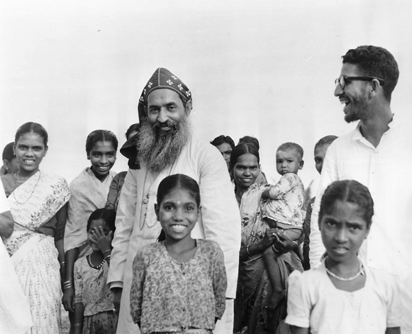 (1968) Archbishop Benedict Mar Gregorios of the Syro-Malankara Catholic Rite celebrates the winning of top honors in a food production contest sponsored by the Communist-rule state of Kerala. The prelate produced a rice variety in his own experimental rice paddies which had a yield of 8,000 pounds per acre - nearly seven times the average in this densely populated area of India. The 52-year-old archbishop, with the aid of American Catholics and the Catholic Near East Welfare Association, establishes parishes and social action centers which he insists are agriculturally self-supporting. Religion News Service