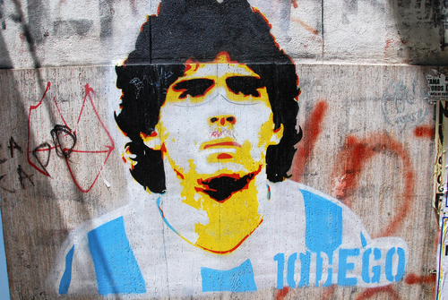 Graffiti of soccer star Diego Maradona in Buenos Aires. Image courtesy of meunierd via Shutterstock. 