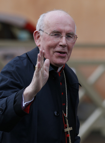 Cardinal Sean Brady of Armagh, Northern Ireland, greets media as he arrives for the final general congregation meeting in the synod hall at the Vatican March 11, 2013. Photo by Paul Haring, courtesy of Catholic News Service