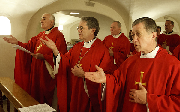 Blase J. Cupich of Spokane, Wash., far right, concelebrates Mass in 2012 with other U.S. bishops in the crypt of St. Peter's Basilica at the Vatican. Pope Francis has named Bishop Cupich as archbishop of Chicago, succeeding Cardinal Francis E. George. Photo by Paul Haring, courtesy of Catholic News Service