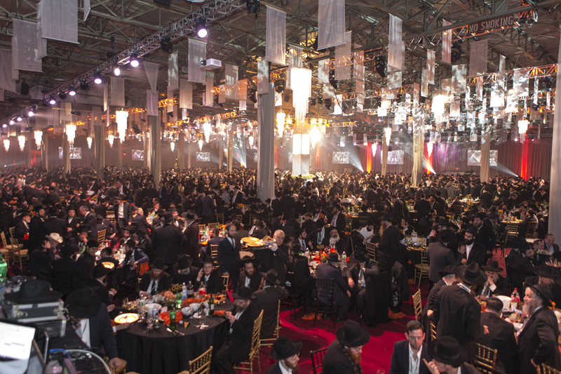 Rabbis are seen in this photo among their colleagues at a banquet at the South Brooklyn Marine Terminal in the Brooklyn borough of New York on November 23, 2014. They are among 5,200 rabbis and guests from over 80 countries in New York for the International Conference of Chabad-Lubavitch Emissaries, an annual event aimed at reviving Jewish awareness and practice around the world. Photo by Adam Ben Cohen / Chabad.org 
