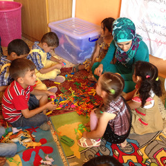 Children learn and play in a Child Friendly Space near Jordan's Zataari refugee camp. The camp houses nearly 100,000 refugees. - Photo taken by permission; Image credit: Jonathan Merritt