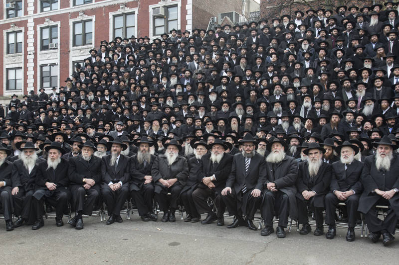 Thousands of rabbis pose for a group photo in front of Chabad-Lubavitch world headquarters in the Brooklyn borough  of New York on Sunday, Nov. 23, 2014. They are among 4,200 rabbis from around the world who are in New York for the International Conference of Chabad-Lubavitch Emissaries, an annual event aimed at reviving Jewish awareness and practice around the world. Photo by Adam Ben Cohen / Chabad.org