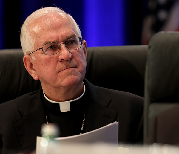 Archbishop Joseph E. Kurtz of Louisville, Ky., left, president of the U.S. Conference of Catholic Bishops, and Msgr. Ronny E. Jenkins, USCCB general secretary, listen to a speaker Monday (Nov. 10, 2014) during the bishops' annual fall general assembly in Baltimore. Photo by Bob Roller, courtesy of Catholic News Service