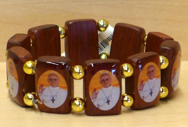Wood bracelet on stretch nylon cord with 1" tall images of Pope Francis. Made in Brazil for Religious Art, Inc.