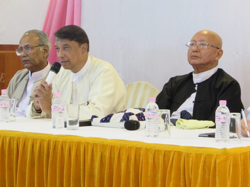 U Aye Lwin, chief convener of the Islamic Centre of Myanmar and founding member or Religions for Peace addresses a room of journalists at Religion Newswriters' panel in Yangon on November 13, 2014. From left to right: U Myint Swe, president of the Ratana Metta Organization, U Aye Lwin, and U Aung Naing, executive committee member of Religions for Peace.
