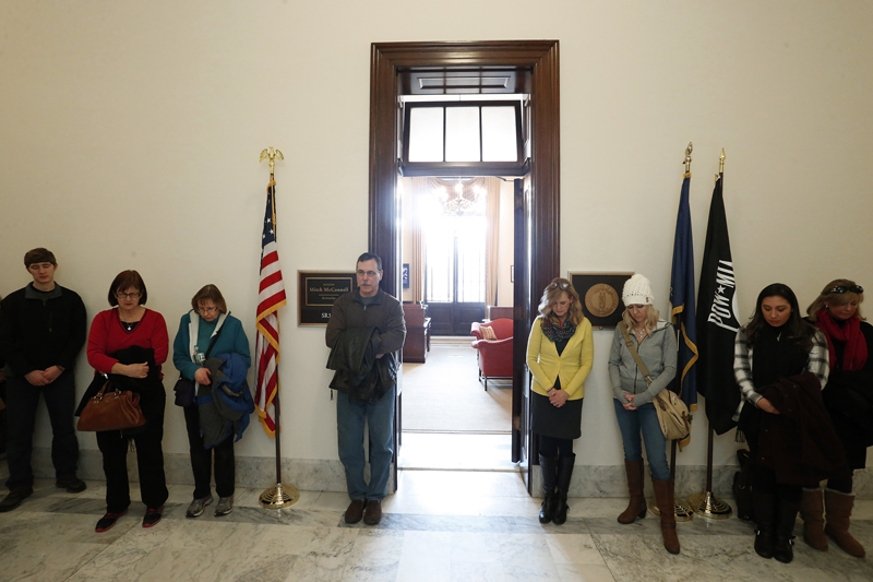 Anti-abortion demonstrators pray in the hallway outside Senate Majority Leader Mitch McConnell's legislative office on Capitol Hill in Washington on January 22, 2015. Photo courtesy of REUTERS/Jonathan Ernst *Note: This photo may only be republished with RNS-ABORTION-DEFEAT, originally published on January 22, 2015, or RNS-ABORTION-MARRIAGE, originally published on July 2, 2015.