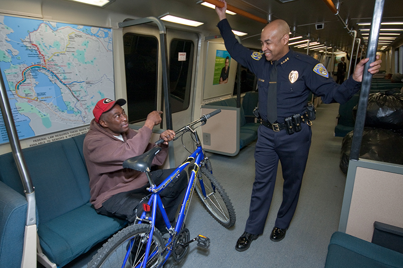 BART Police Chief Kenton Rainey, who leads a department of more than 200 officers, speaks with a passenger. Photo courtesy of BART 