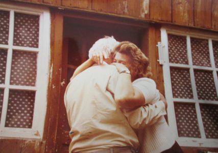 Holocaust survivor Shalom Lindenbaum hugs Dorota Froelich Kuc, the Polish Christian woman who saved his life during the Holocaust, circa 1980's. Photo courtesy of Michele Chabin
