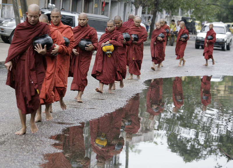 Buddhist monks walk in a procession while collecting alms in Yangon, on May 19, 2008. Buddhists in Cyclone Nargis-hit Myanmar celebrated the Kason festival, or Vesak Day, today marking the enlightenment of Buddha. Photo courtesy of REUTERS/Stringer 
*Editors: This photo may only be republished with RNS-MYANMAR-NOISE, originally transmitted on February 13, 2015