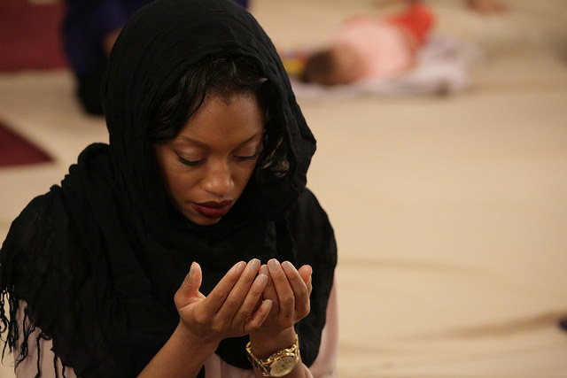 A woman prays during Friday Muslim prayers on Jan. 30, 2015. Photo courtesy of Alexa Pilato