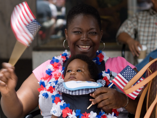 A woman and her baby during a July 4th parade in Atlanta, Ga. 