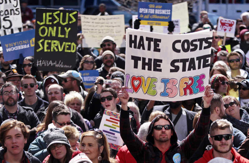 Demonstrators gather at Monument Circle to protest a controversial religious freedom bill recently signed by Governor Mike Pence, during a rally in Indianapolis on March 28, 2015.  More than 2,000 people gathered at the Indiana State Capital Saturday to protest Indiana's newly signed Religious Freedom Restoration Act, saying it would promote discrimination against individuals based on sexual orientation. Photo courtesy of REUTERS/Nate Chute
*Editors: This photo may only be republished with RNS-INDIANA-PENCE, originally transmitted on March 30, 2015.