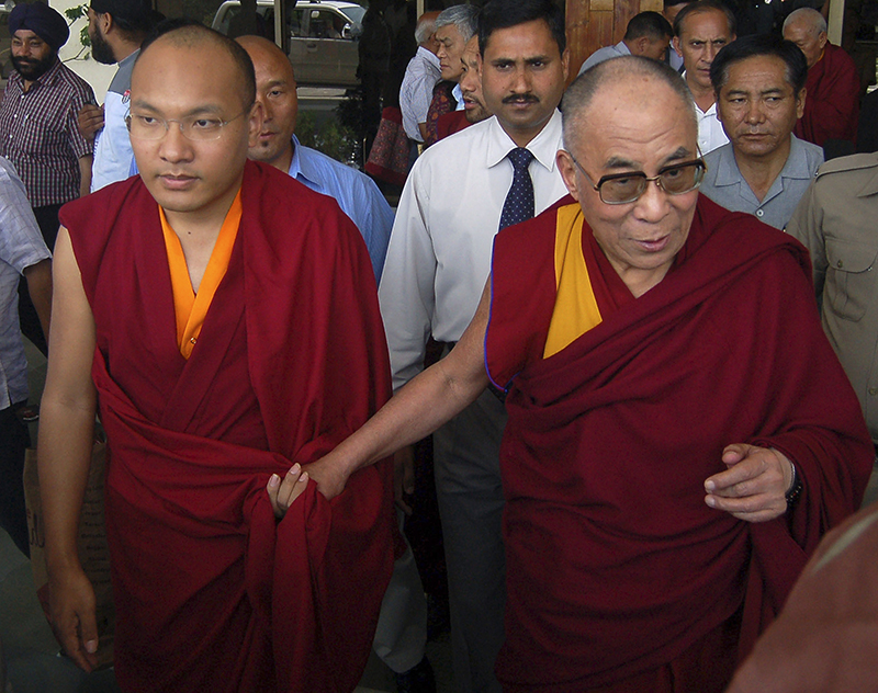 Karmapa Lama, left, and Tibet's exiled Buddhist spiritual leader the Dalai Lama arrive at the Kangra airport on the outskirts of the northern Indian hilltown of Dharamsala on May 16, 2011. Photo courtesy of REUTERS/Stringer 
*Editors: This photo can only be republished with RNS-KARMAPA-HARVARD, originally transmitted on March 26, 2015.