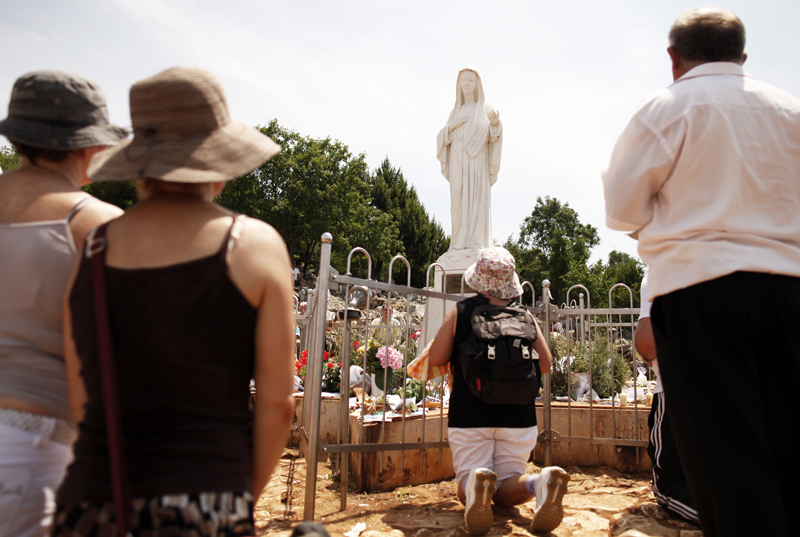 Catholics pray at the site where the Virgin Mary reportedly appeared as an apparition in Medjugorje, 120 km (75 miles) south of Sarajevo on June 25, 2012. Millions of pilgrims from all over the world have visited the small Bosnian town after six Bosnian youngsters claimed that the Holy Mary appeared to them there 31 years ago. Photo courtesy of REUTERS/Dado Ruvic
*Editors: This photo may only be republished with RNS-MEDJUGORJE-SPEECH, originally transmitted on March 18, 2015.