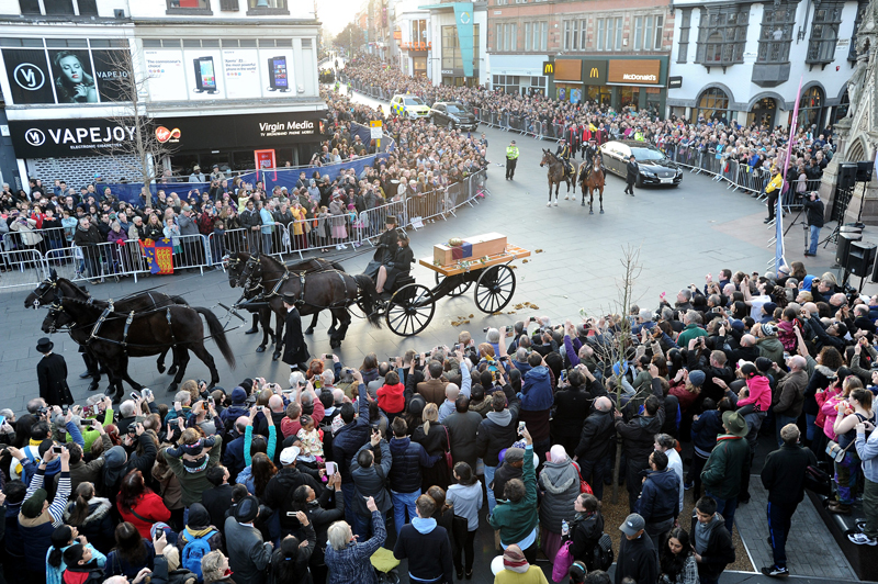 During the reinterment ceremony of King Richard III, the coffin goes around the center of Leicester. Here, the funeral procession goes past the Clocktower. Photo by Chris Gordon, courtesy of the Diocese of Leicester