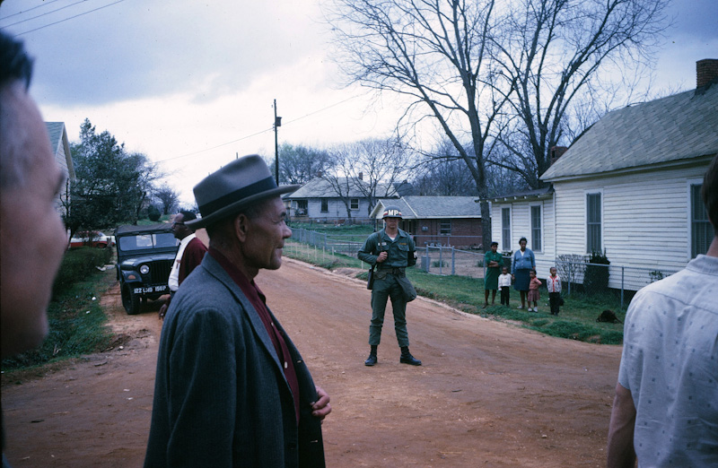 Armed National Guard Military Police observing the Selma-to-Montgomery march through the outskirts of Montgomery on March 25, 1965. Photo by Loy Williams, courtesy of Southern Methodist University