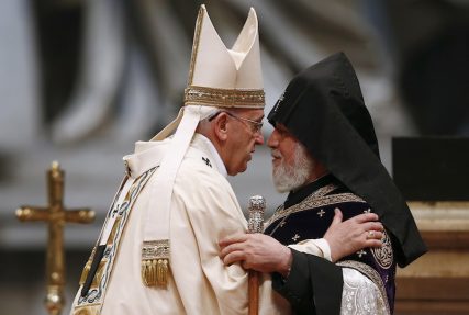 Pope Francis embraces Catholicos of All Armenians Karekin II during a Mass on the 100th anniversary of the Armenian killings.