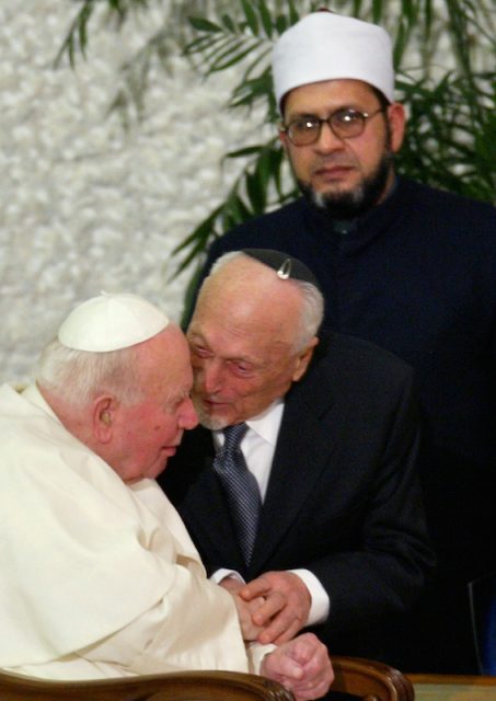 Pope John Paul II chats with emeritus Rabbi of Rome Elio Toaff as Abdulawahab Hussein Gomaa, Iman of Rome Mosque, looks on behind them at the end of the Concert of Reconciliation in Paul VI Hall at the Vatican Jan. 17, 2004. Photo by REUTERS/Max Rossi.