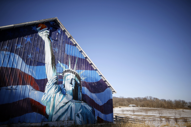 A barn is painted with an image of the Statue of Liberty and a U.S. flag in Mt. Vernon, Iowa, March 8, 2015. Iowa, the American heartland. Endless farm fields and quiet towns. 56,273 square miles that are soon to become the focus of the nation as the long process of electing the next U.S. president begins. Photo courtesy of REUTERS/Jim Young *Editors: This photo may only be republished with RNS-EHRICH-COLUMN, originally transmitted on April 14, 2015.