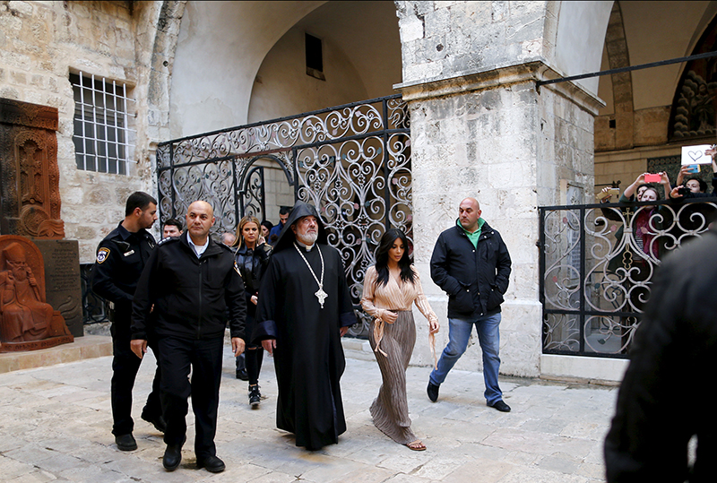 U.S. reality TV star Kim Kardashian, second from right, leaves the Cathedral of Saint James after a baptism ceremony for her daughter in Jerusalem's Old City on April 13, 2015. Photo courtesy of REUTERS/Ammar Awad
*Editors: This photo may only be republished with RNS-KIMK-ISRAEL, originally transmitted on April 16, 2015.