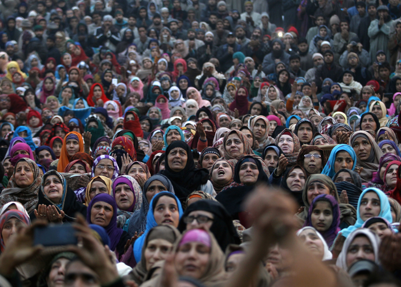 Kashmiri Muslims pray upon seeing a relic of Prophet Mohammad being displayed to devotees, during the festival of Eid-e-Milad at Hazratbal shrine on a cold winter morning in Srinagar on January 4, 2015. Photo courtesy of REUTERS/Danish Ismail 
*Editors: This photo may only be published with RNS-PEW-RELIGION, originally transmitted on April 2, 2015.